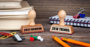 2017 review and 2018 trends. Rubber Stamp on desk in the Office. Business and work background